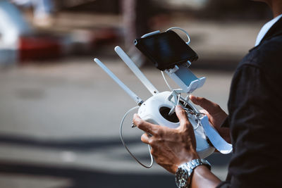 Close-up of man photographing