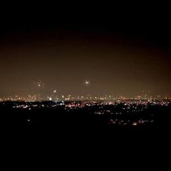 Illuminated cityscape at night