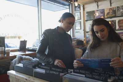 Two women in a record store.