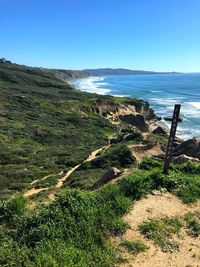 Scenic view of sea against clear blue sky