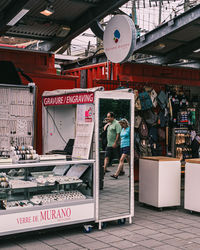 People standing at market stall