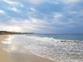 Scenic view of beach against sky