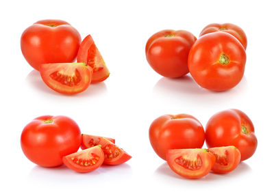 Close-up of tomatoes against white background