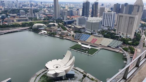 High angle view of river amidst buildings in city