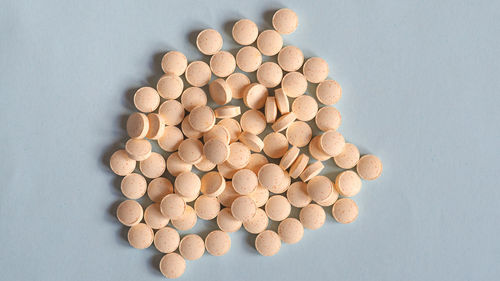 Directly above shot of pills on white background