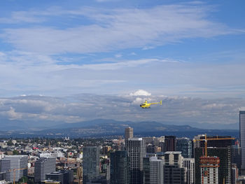 Aerial view of cityscape against sky