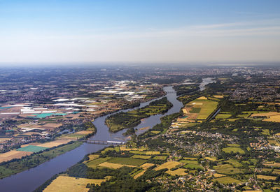 High angle view of buildings and city against sky