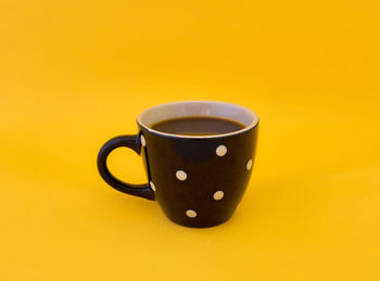 Close-up of coffee cup on table