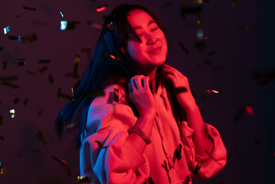 Young woman dancing in party