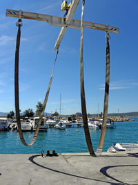 Boats sailing in sea against sky