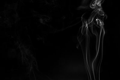 Close-up of smoke against black background