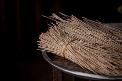 Close-up of dried twigs against black background