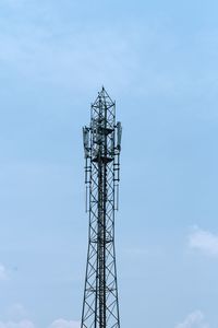 Low angle view of communications tower against sky