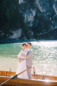 Couple standing by water