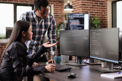 Side view of man working in office