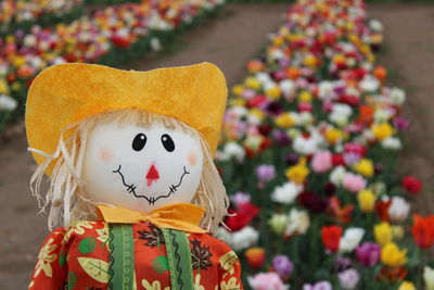 Close-up of stuffed toy against flowers