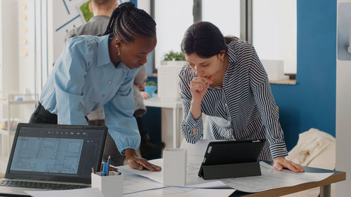 Business colleagues working at office