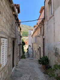 Narrow alley amidst old buildings in town