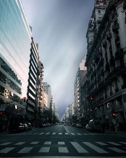 City street against cloudy sky