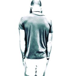 Rear view of man standing against white background