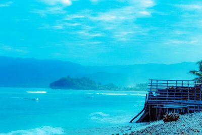 Scenic view of sea against blue sky