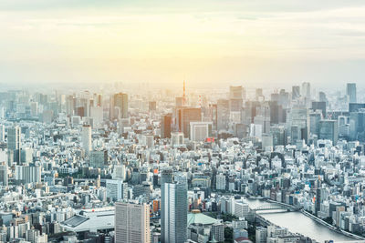 Cityscape against sky during sunset