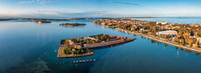 Flying over small venice islands in venetian lagoon.