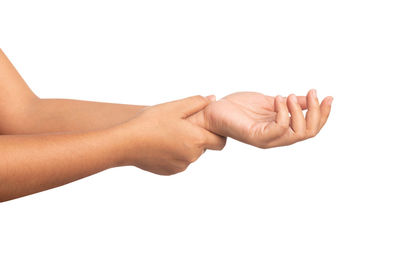 Close-up of hands over white background