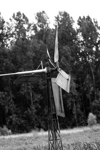 Umbrella on field against trees