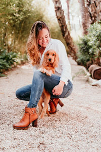 Woman with dog at park