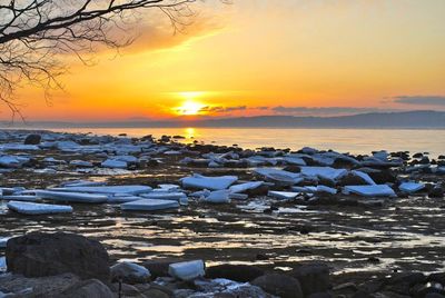 Scenic view of sea at sunset