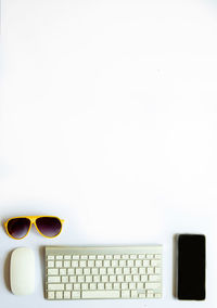 Close-up of laptop on table against white background