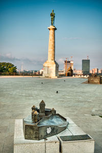 Statue of historic building against sky