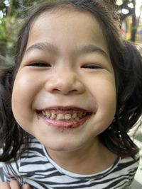 Close-up portrait of a smiling girl