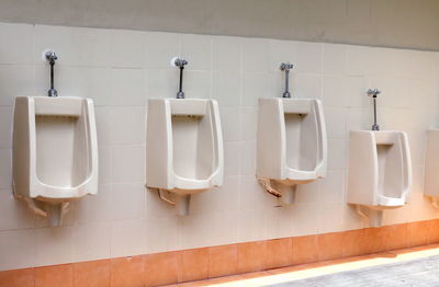 Urinals in public restroom