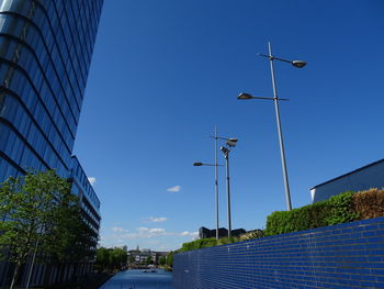 Low angle view of buildings against blue sky
