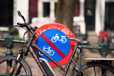 Close-up of bicycle parked on city street