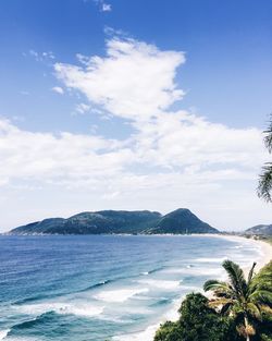 Scenic view of sea against cloudy sky