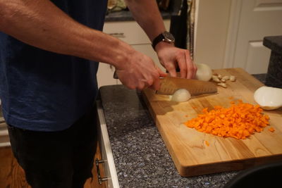 Midsection of man preparing food