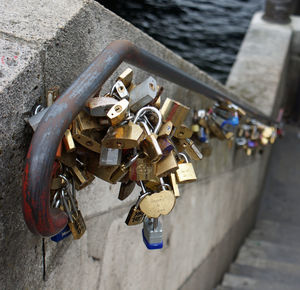 High angle view of padlocks hanging on railing
