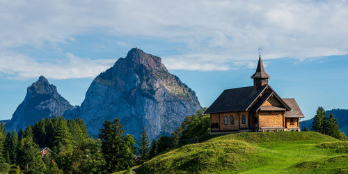 View of an old wooden church in the swiss mountains on lake lucerne.