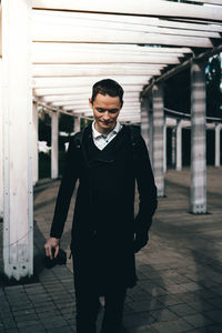 Portrait of young man standing outdoors