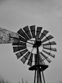 Low angle view of traditional windmill against clear sky