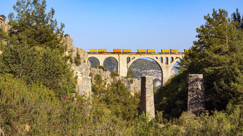Arch bridge against clear sky