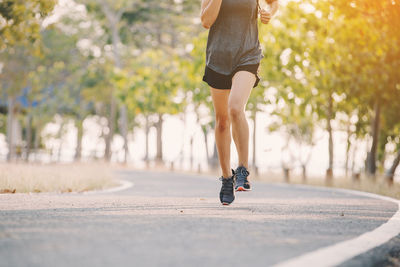 Low section of woman on road