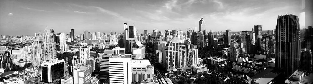 Panoramic view of skyscrapers against sky