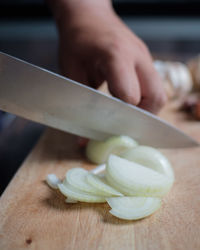 Close-up of person preparing food on cutting board