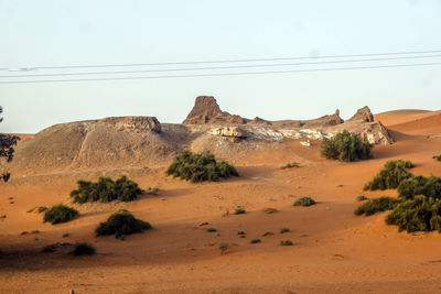 Scenic view of arid landscape against clear sky