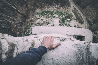 Man looking down from building