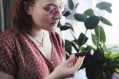 Close-up of woman with weed